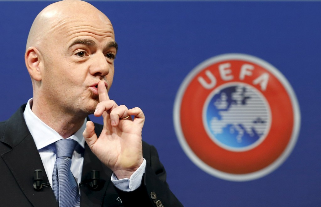 UEFA General Secretary Infantino asks the audience for silence before the draw for the play-off matches for UEFA Euro 2016 at the UEFA headquarters in Nyon
